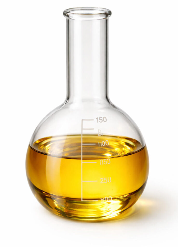 beaker filled with jojoba oil